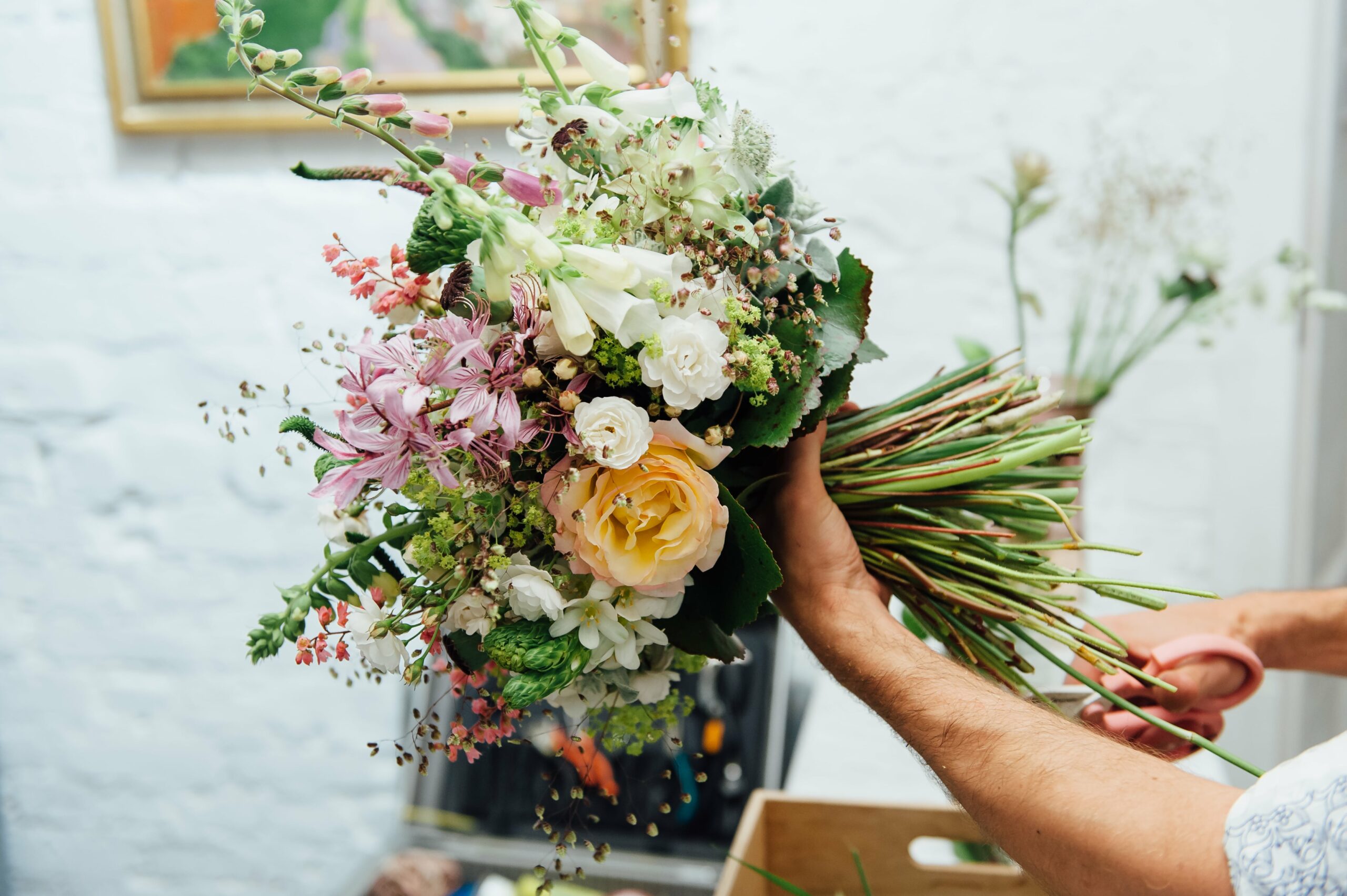 Bridebook.co.uk florist making up wedding bouquet