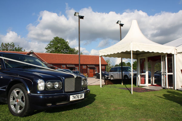 a car is parked outside stables lodge wedding venue