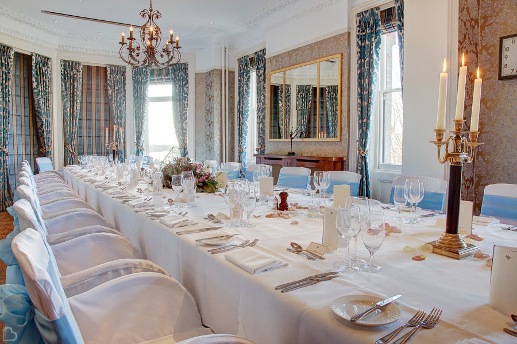 a table is set up for a wedding lunch at the petersham hotel