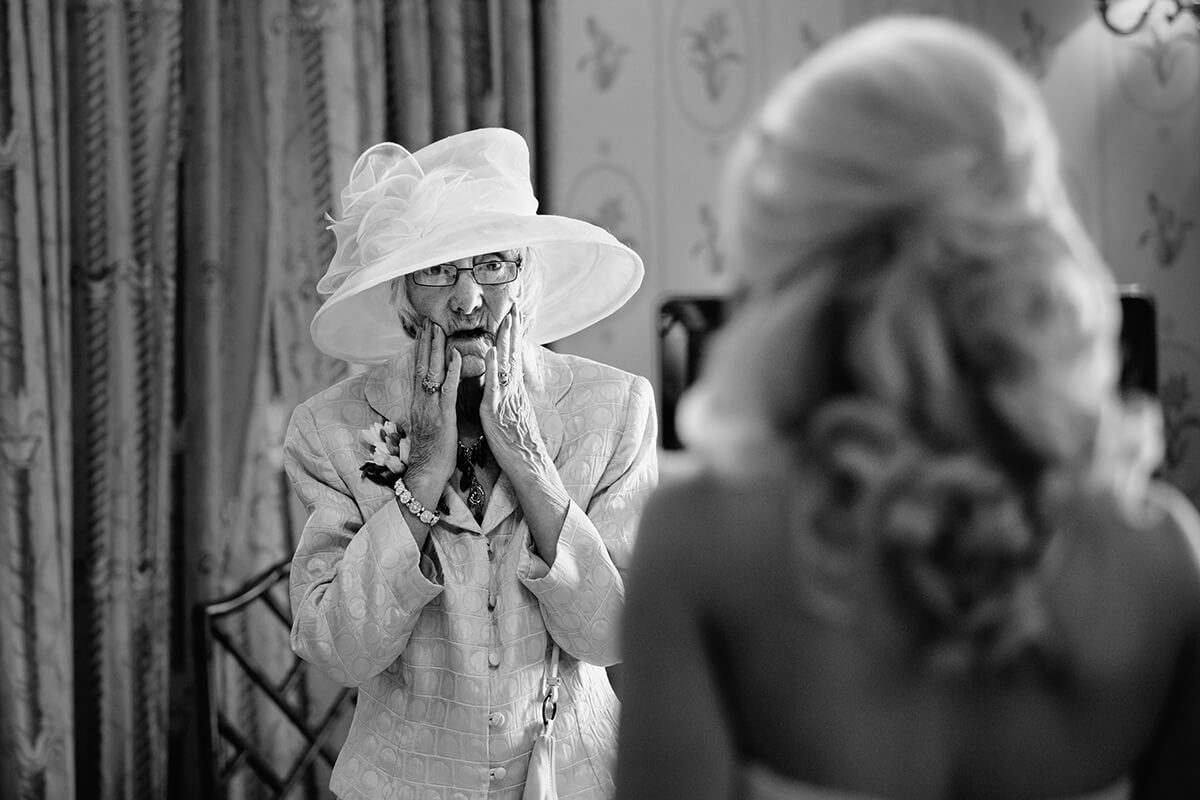 grandma look surprised when she sees the bride for the first time.