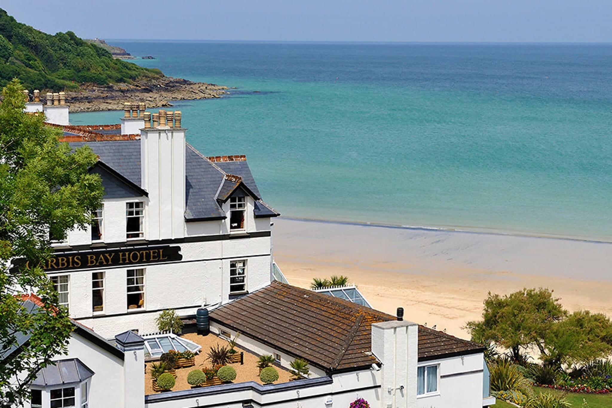 carbis bay hotel on a overlooking the sea on a beautiful sunny day 