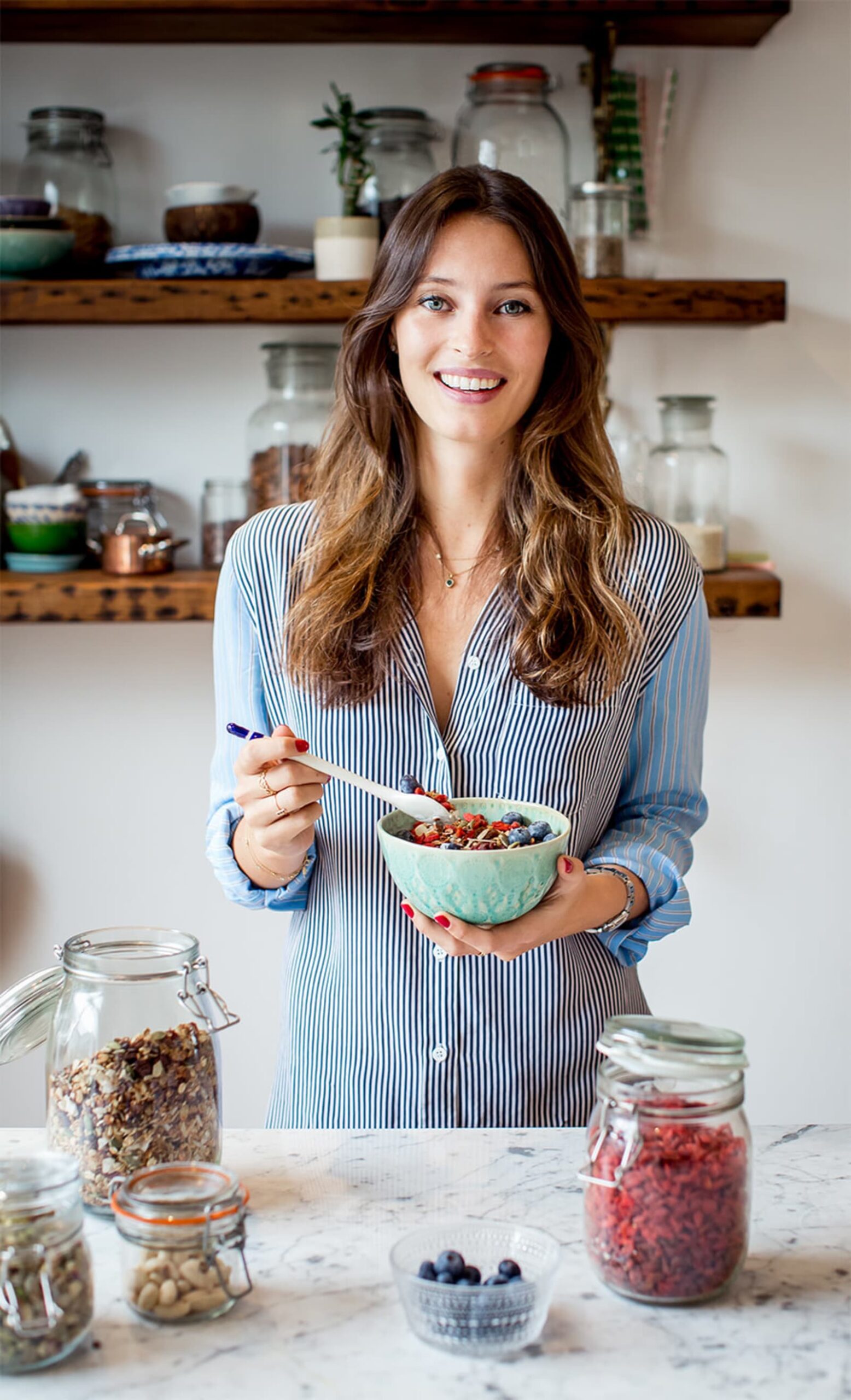 Briebook.co.uk-deliciously-ella-holding-a-bowl-of-cereal-smiling