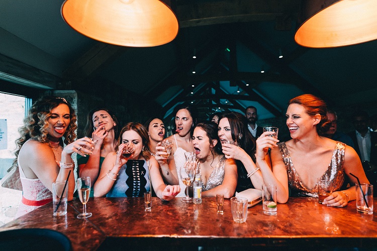 bridebook.co.uk girls drinking at the bar