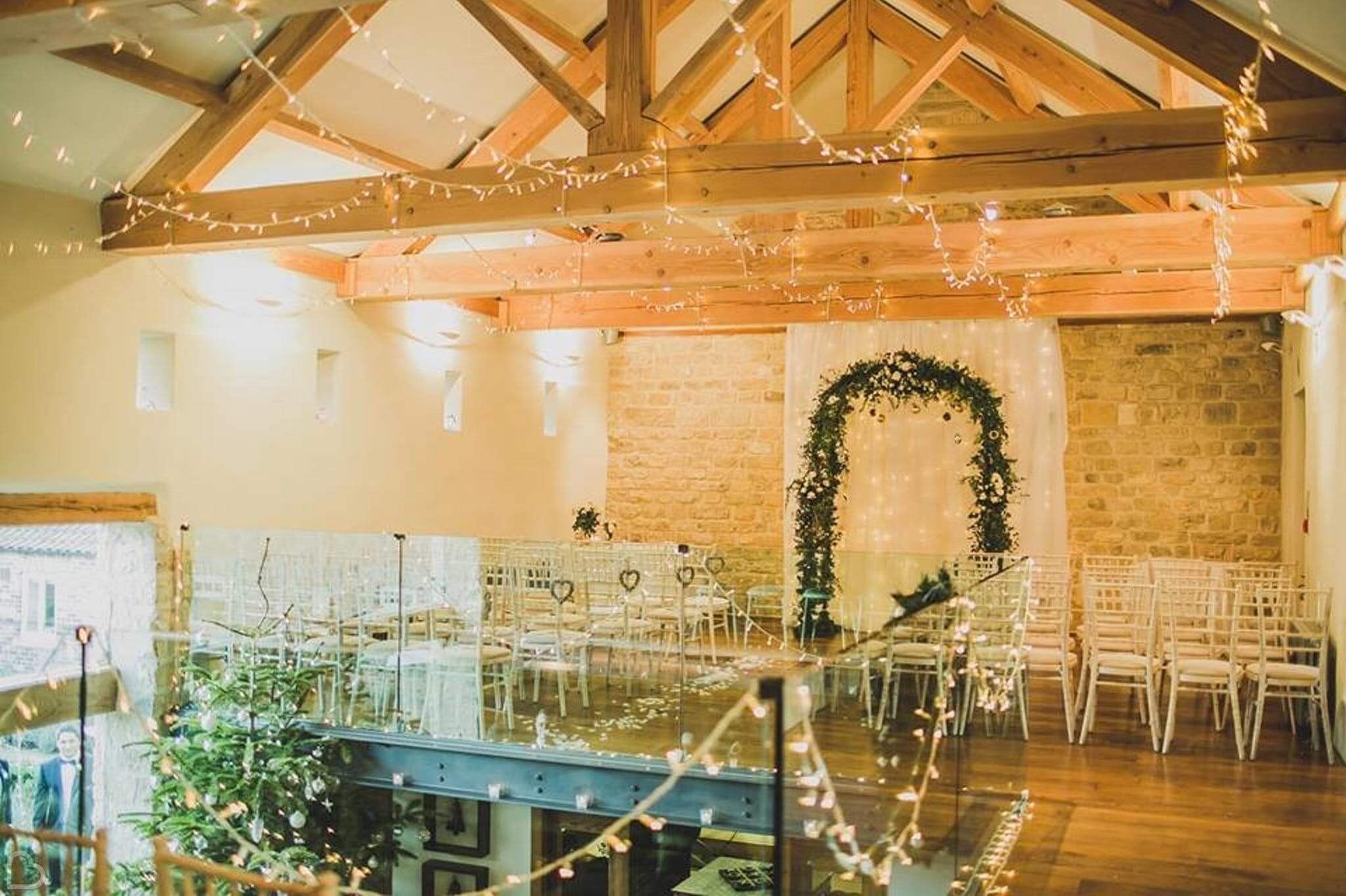 priory cottages interior decorated with fairy lights and greenery for a christmas wedding