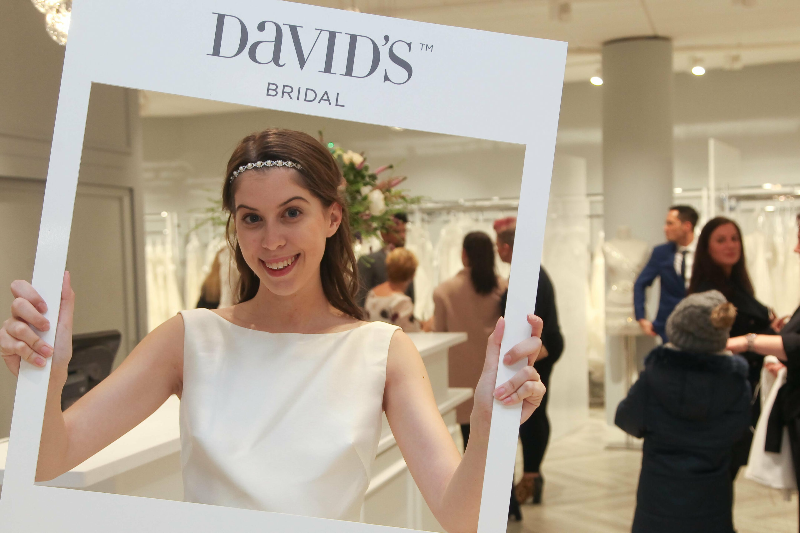 Bridebook.co.uk model holding a davids bridal frame