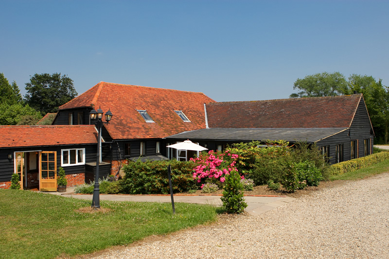 the reid rooms on a sunny day, seen from the outside, a barn wedding venue in essex