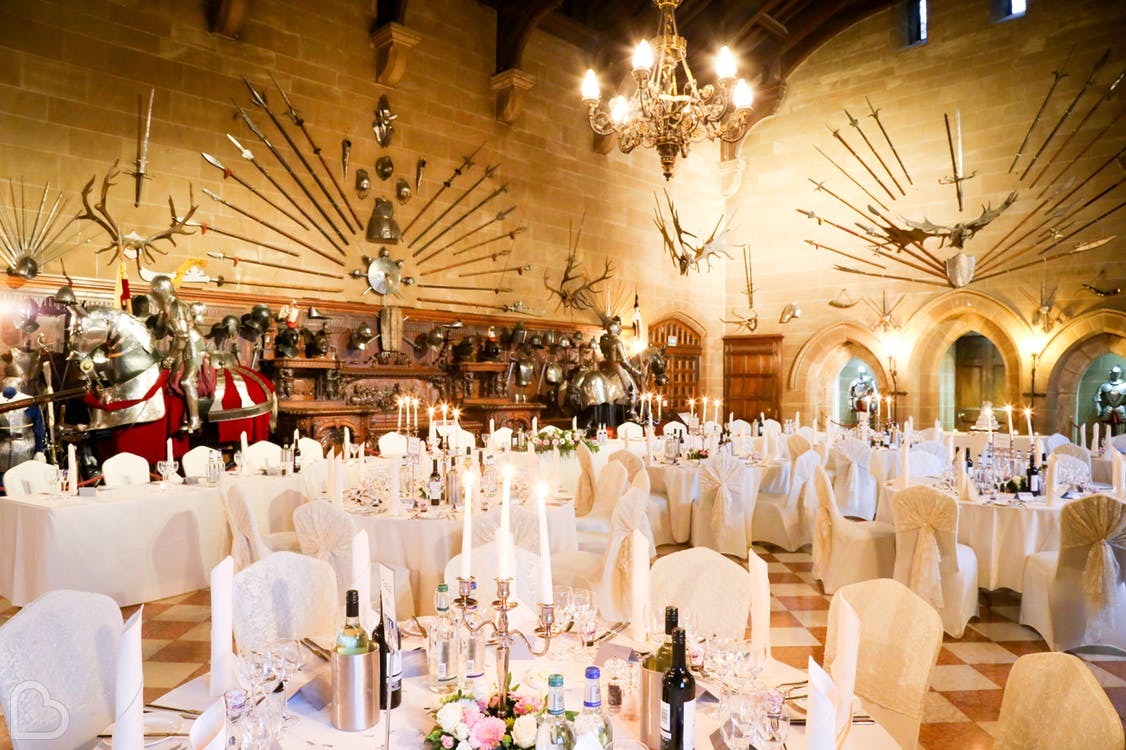 Warwick Castle hall set up for wedding dinner, a historic wedding venue in the uk