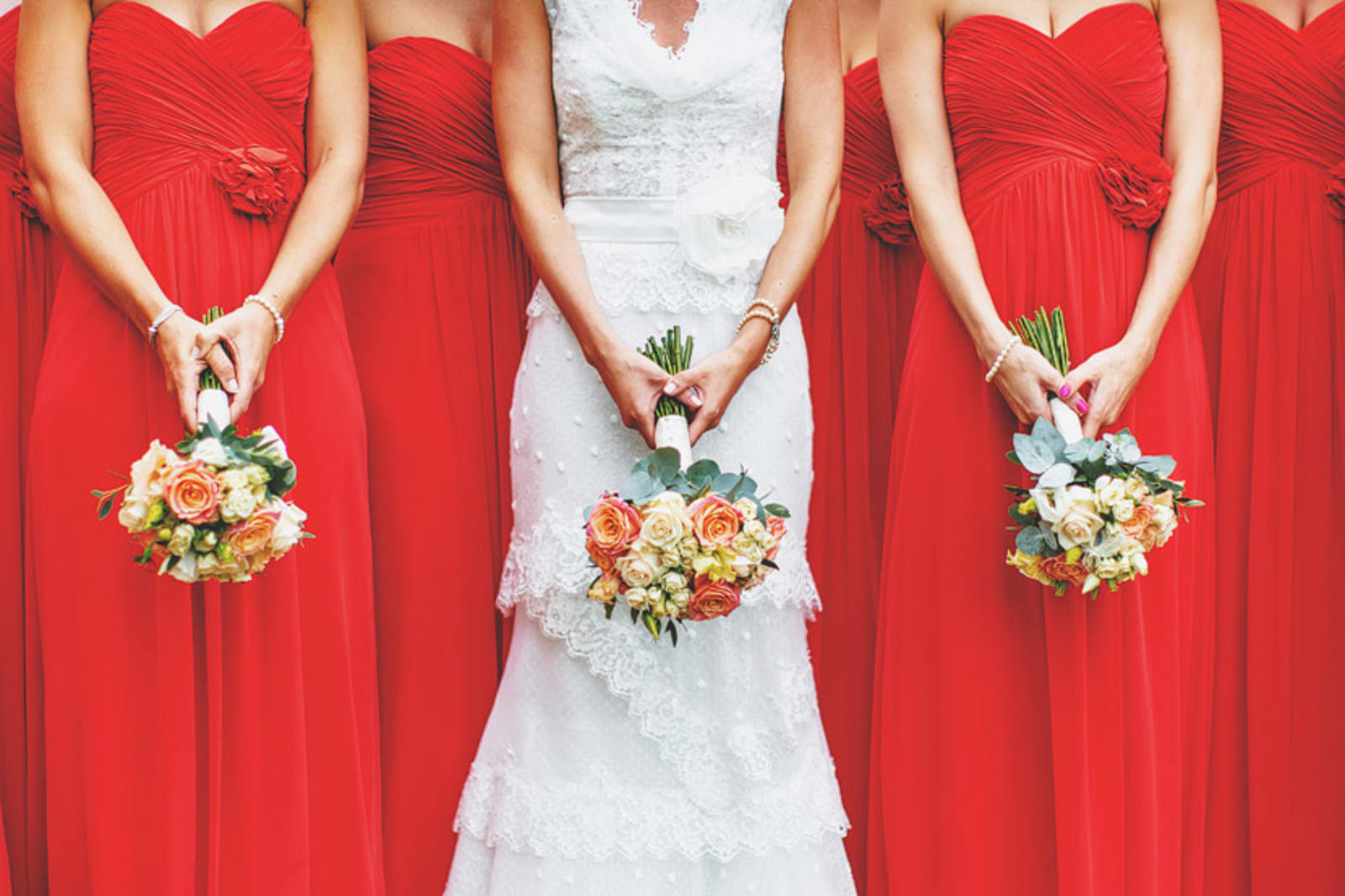 Bridebook.co.uk- bride and bridesmaids holding wedding bouquets