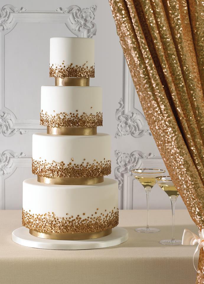 bridebook.co.uk gold accented wedding cake and decor