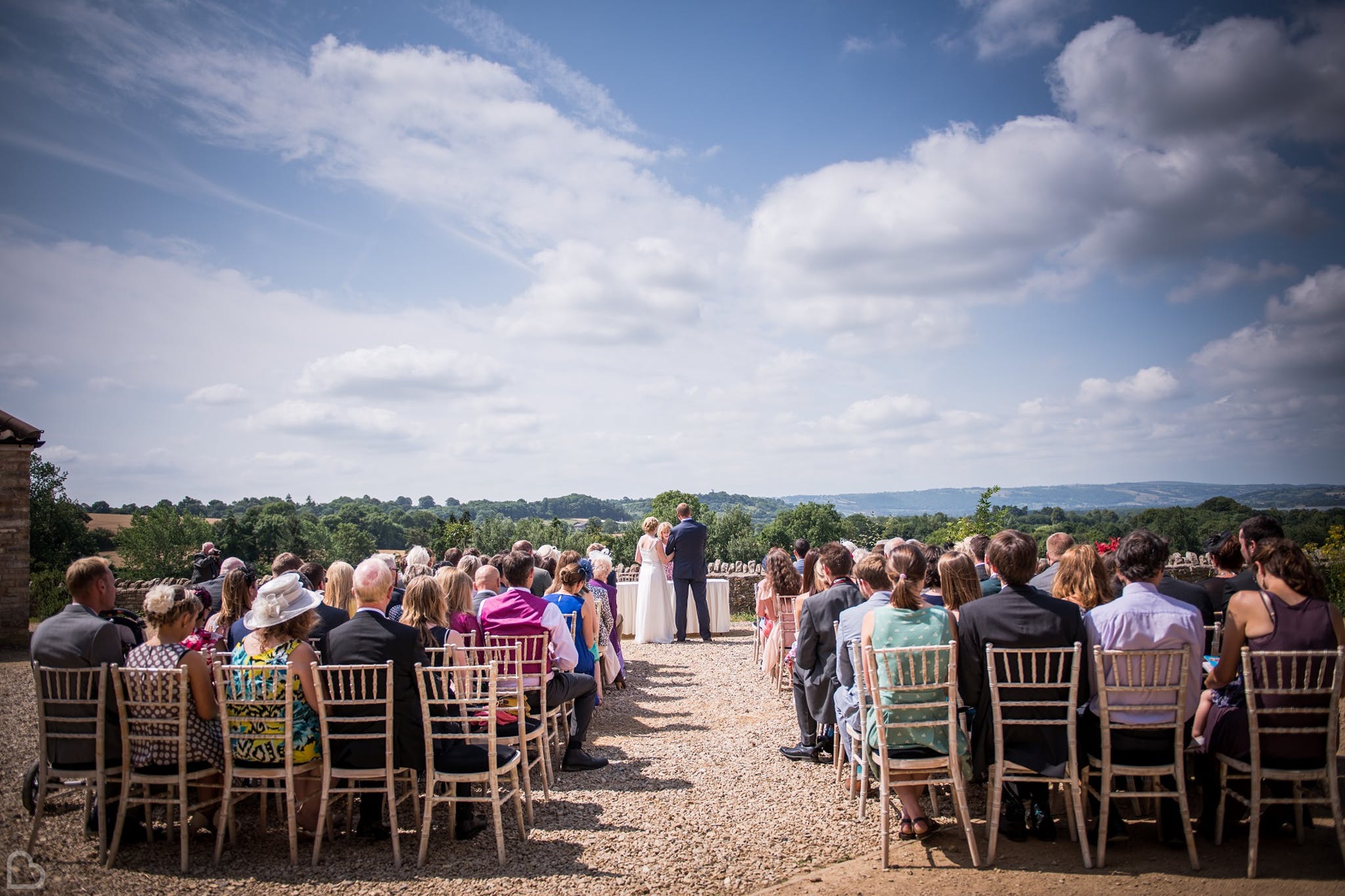 outdoor wedding ceremony going on at folly farm wedding venue 