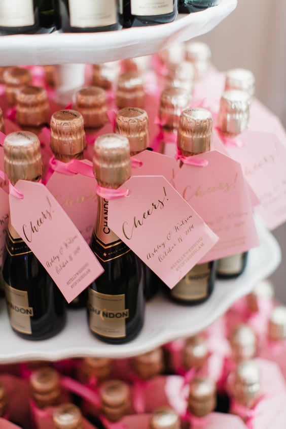 bridebook.co.uk mini pink champagne bottles as wedding  favours