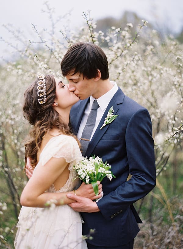 bridebook.co.uk bride and groom outdoors with a tiara