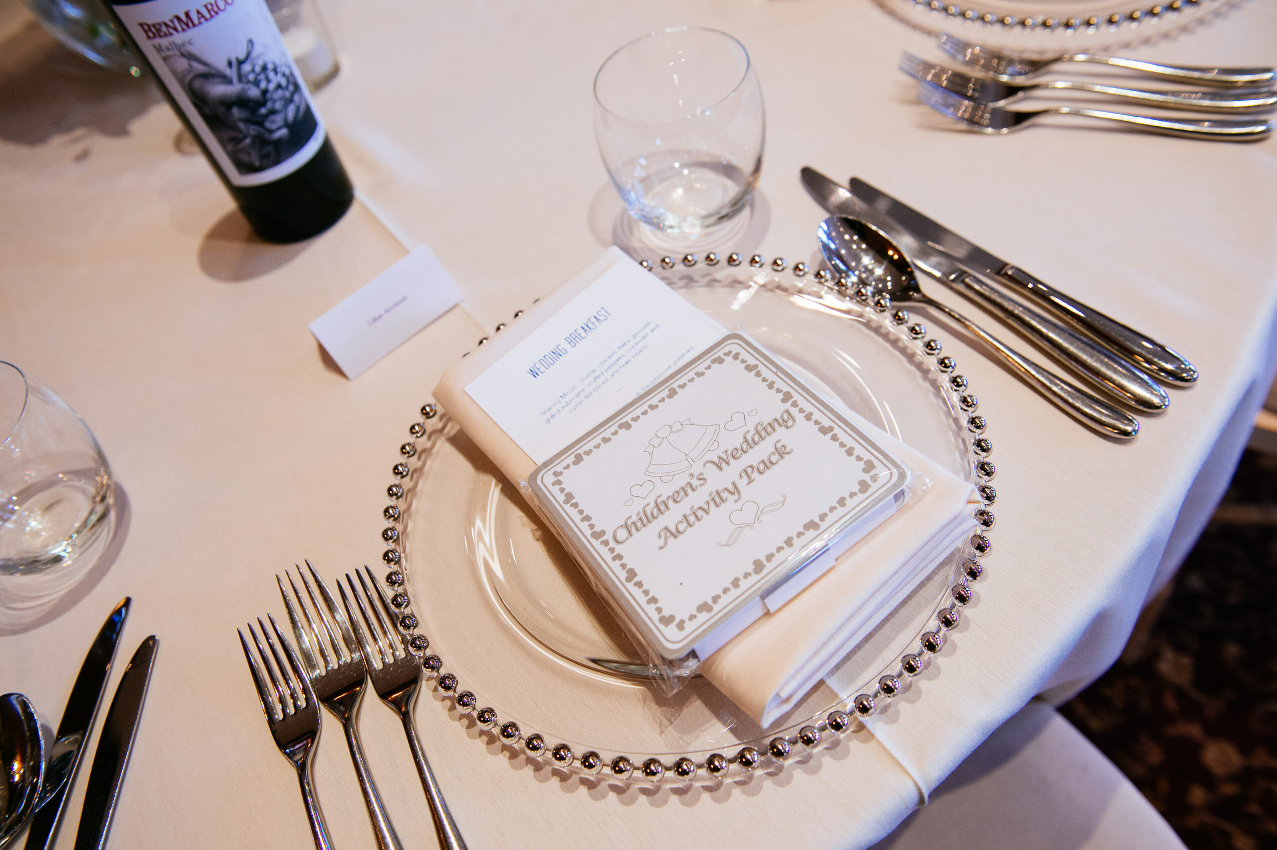 Bridebook.co.uk- wedding menu to match invitations laid out on a plate