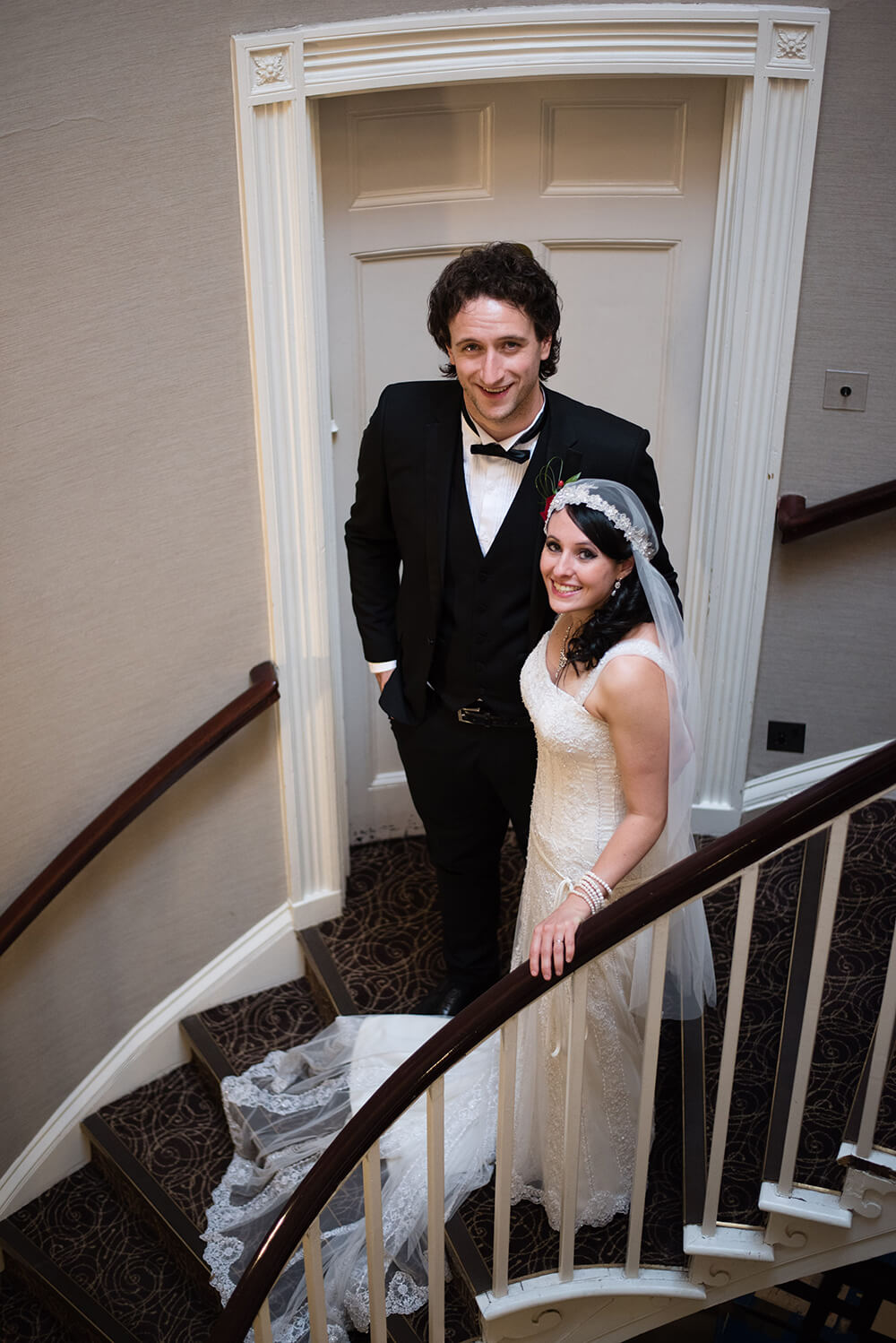Bridebook.co.uk bride and groom on stairs