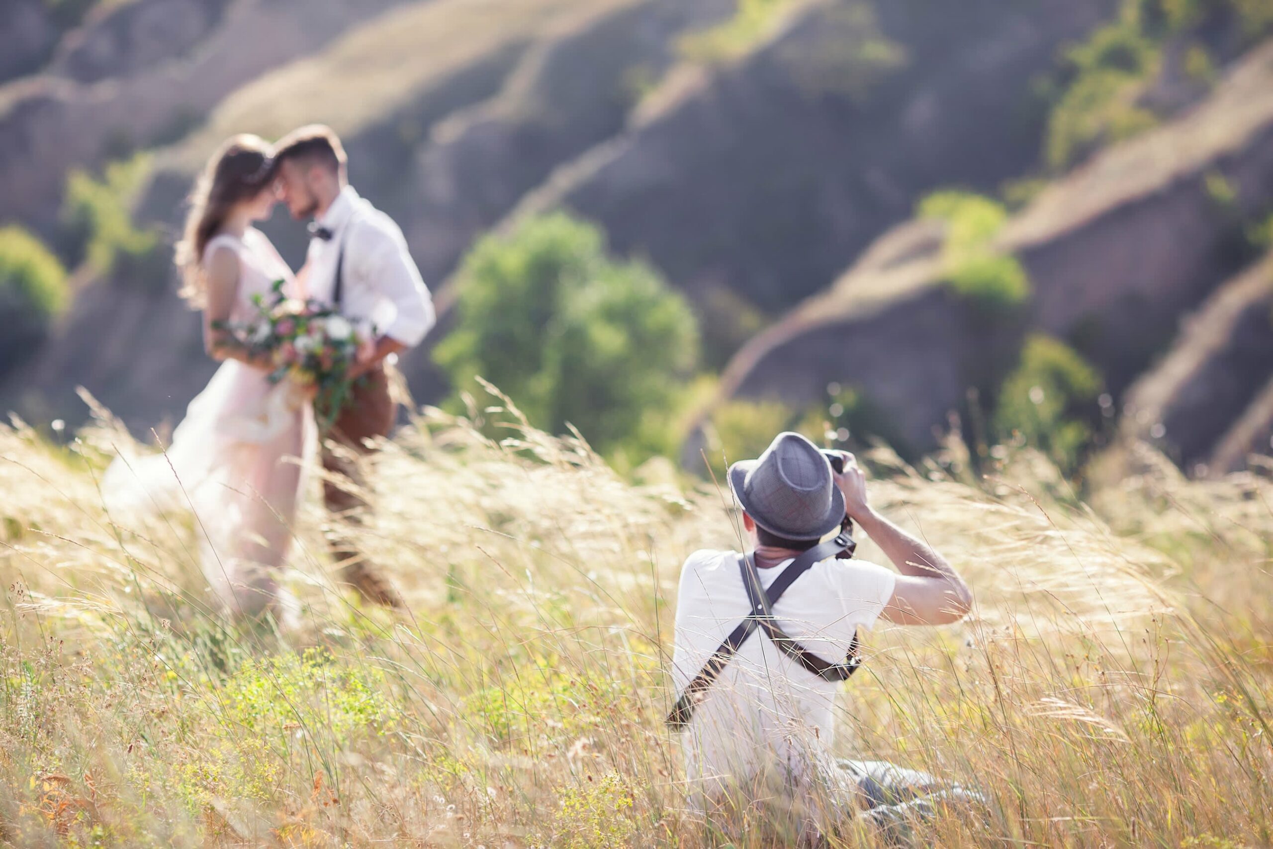 Bridebook.co.uk Wedding videographer in field
