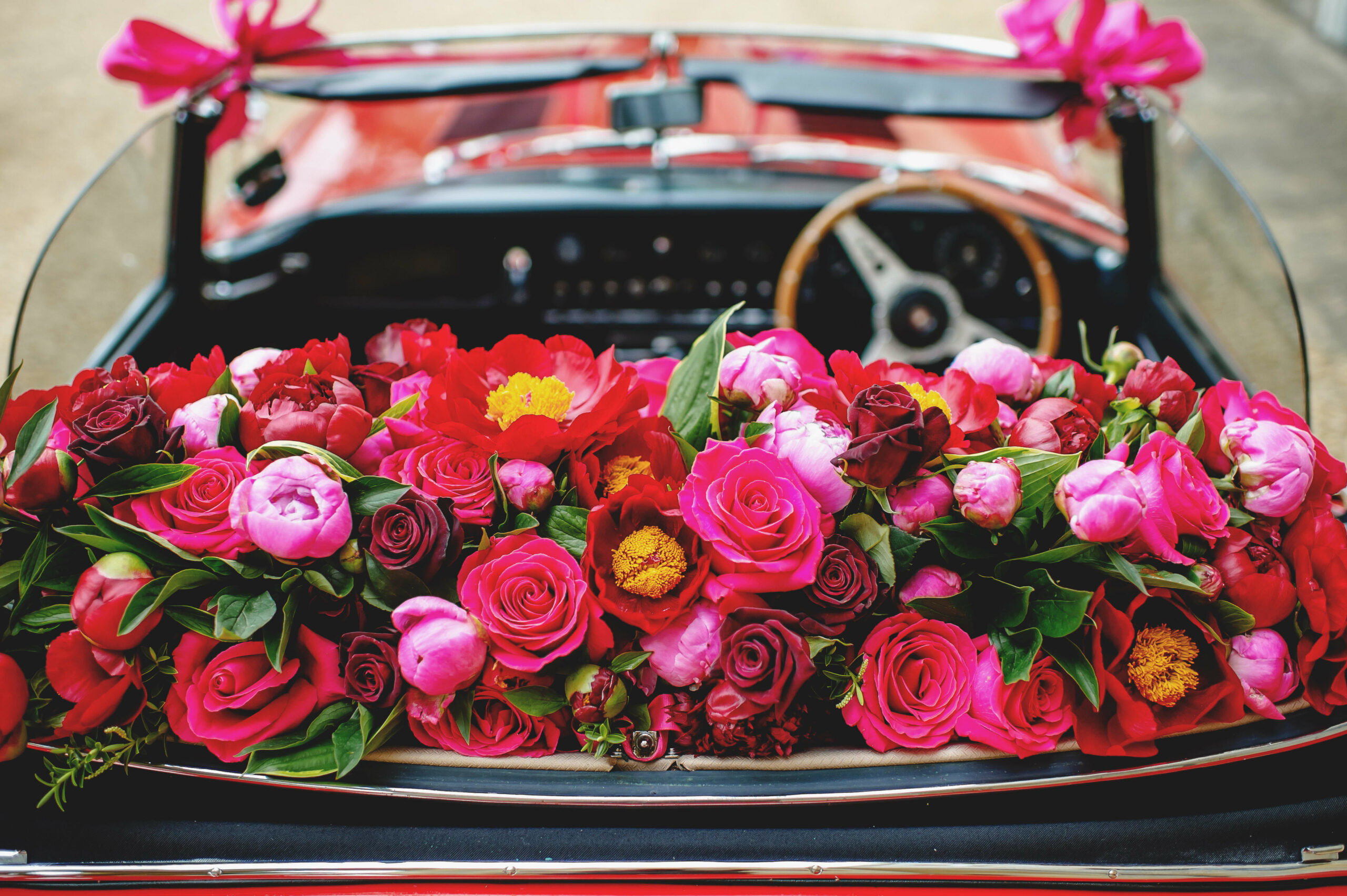 bridebook.co.uk-simon lycett car filled with flowers